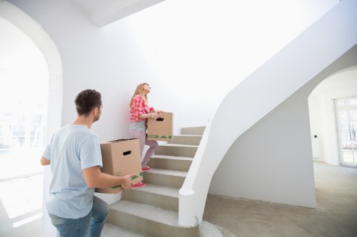 Professional removal team loading furniture for a Newsouthgate move